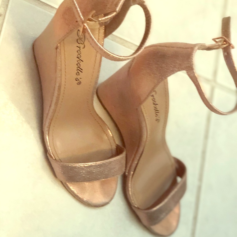 Size 6 wedge heels with strap.